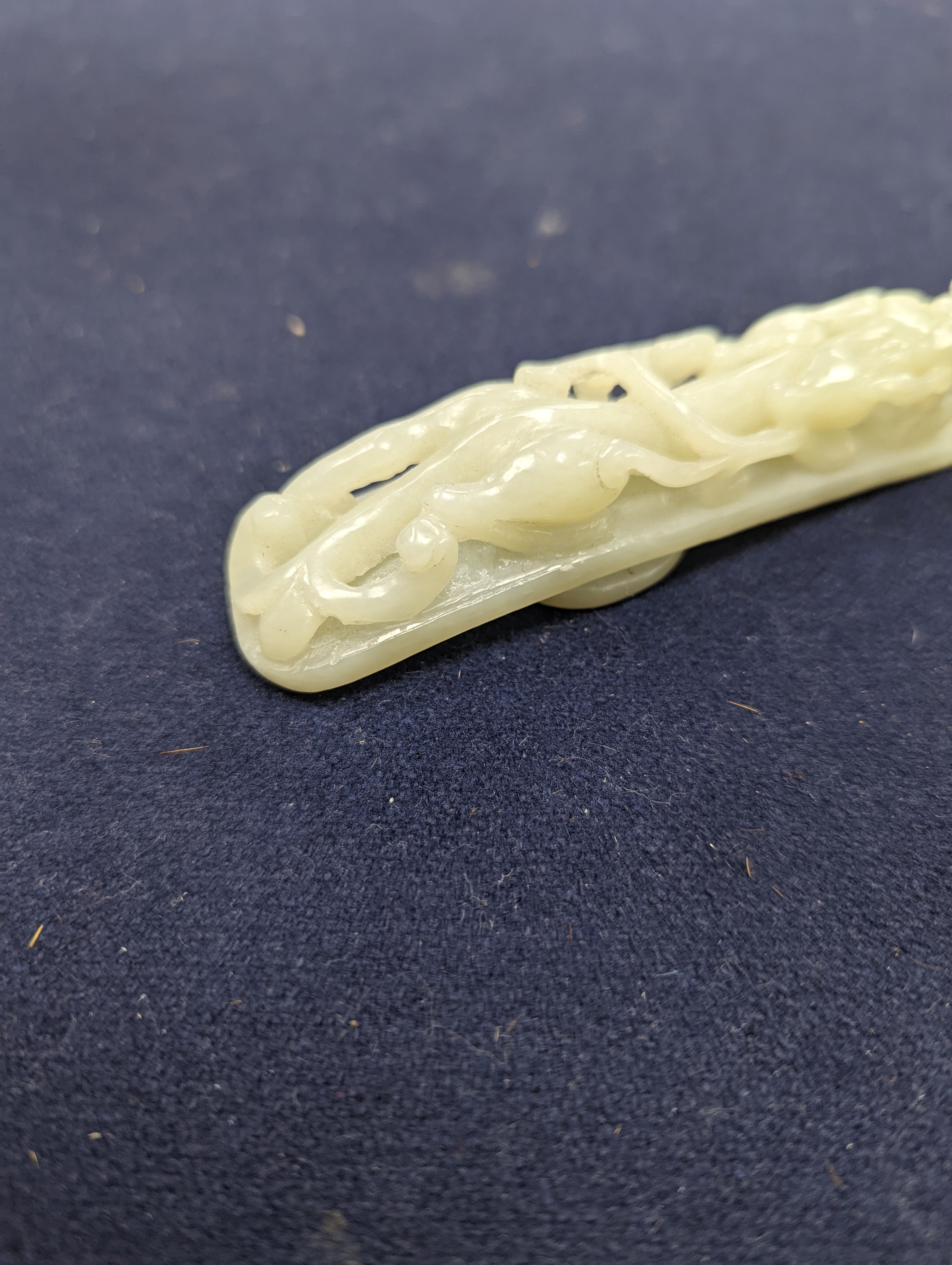 A Chinese jade belt hook, 12.5cm an archer's ring and figure, a stone cup and a glass snuff bottle